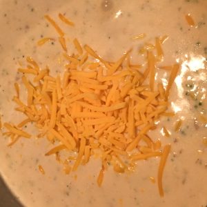 adding cheese to quick broccoli soup