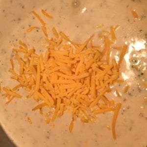 adding cheese to quick broccoli soup