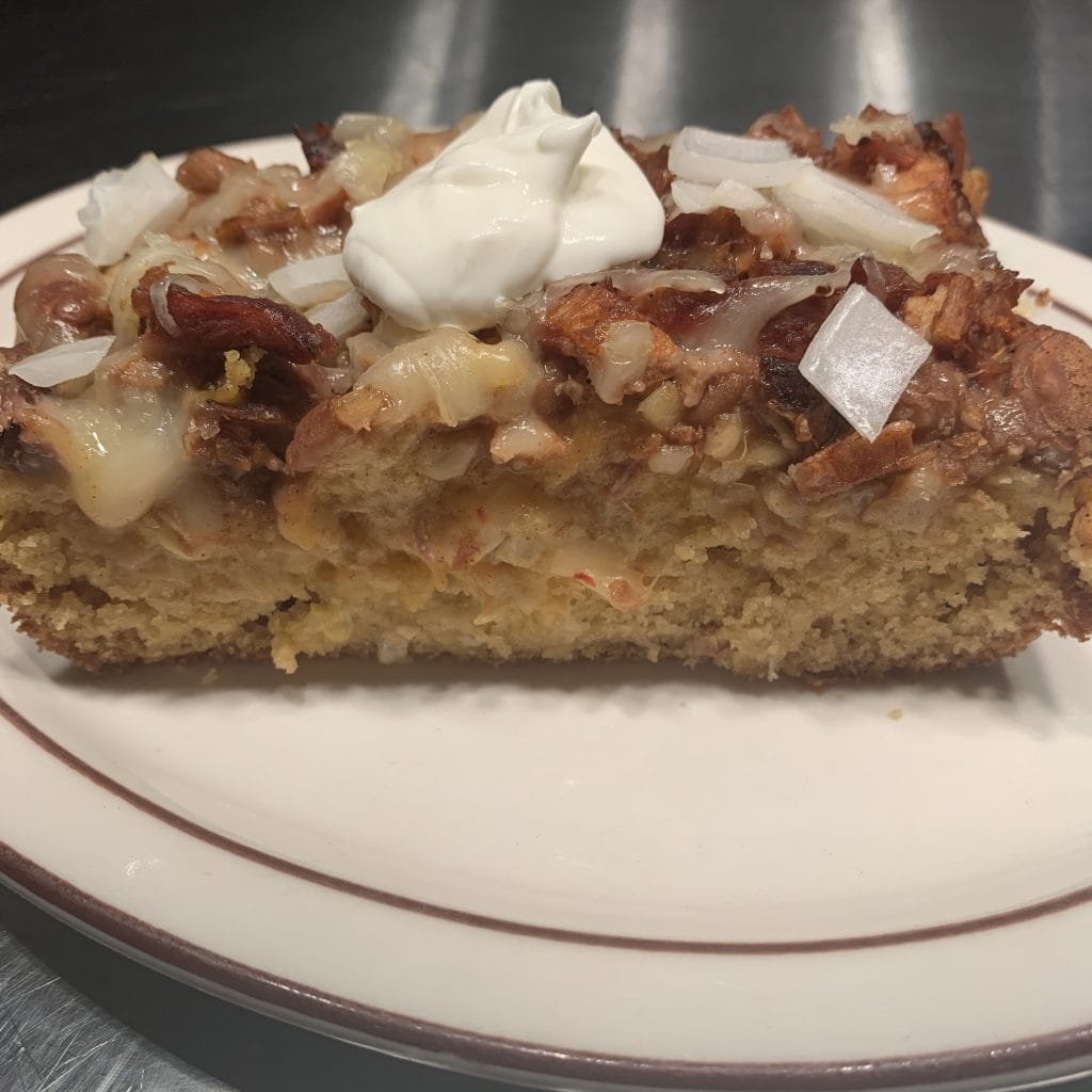 slice of cowboy casserole showing thickness of cornbread mix