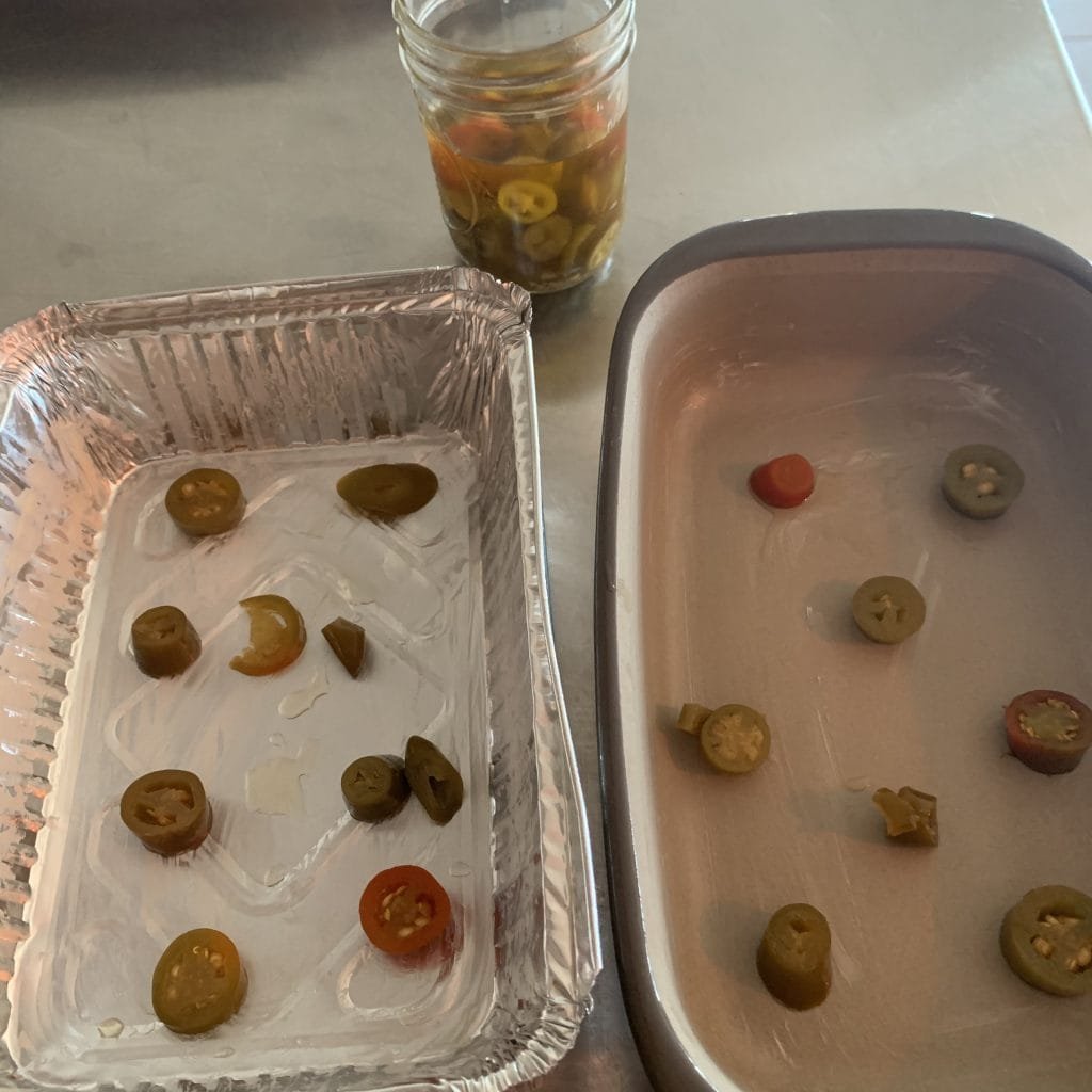 jalapenos in the bottom of the baking pans