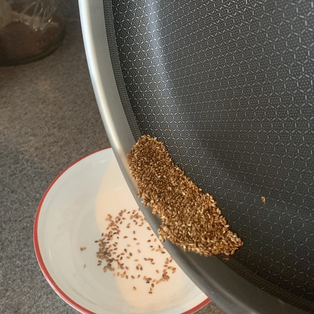 adding seeds to bowl 