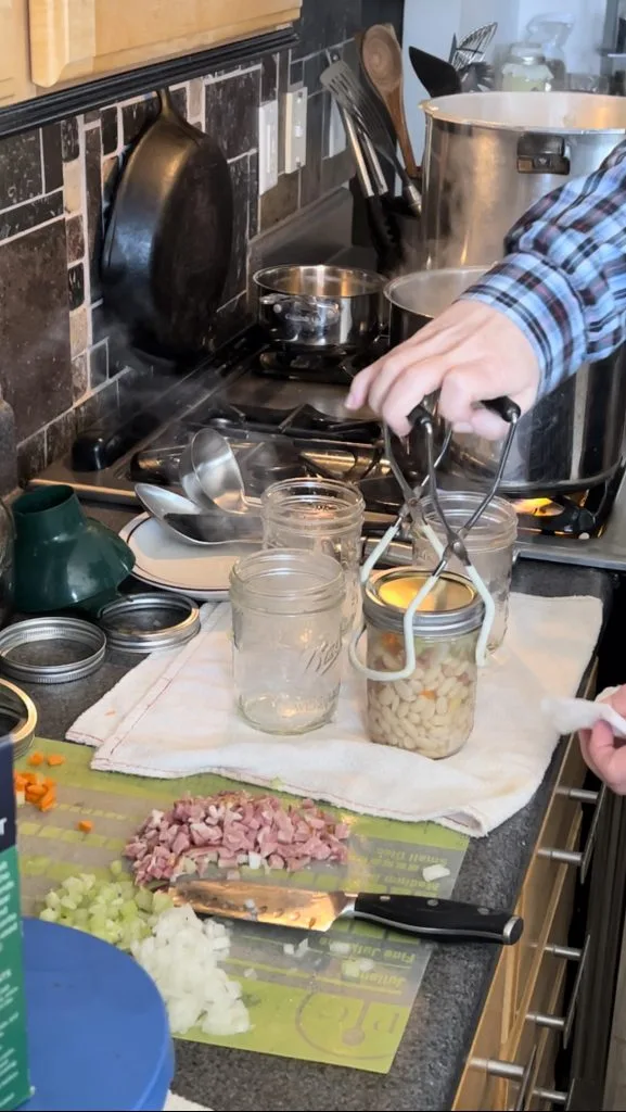 getting ready for second round of filling jars with ham and bean soup