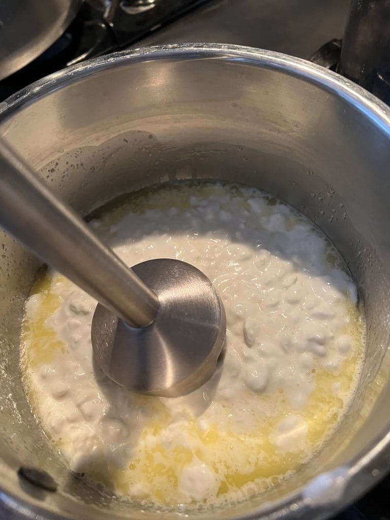 melt butter and warm cottage cheese